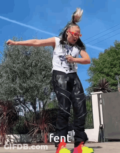 A Woman Wearing A White Tank Top And Black Pants Is Dancing With The Word Fent On The Bottom Right GIF