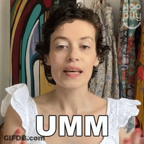 A Woman Wearing A White Top Says Umm GIF