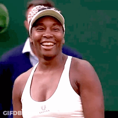 A Woman Wearing A White Top That Says Eleven On It GIF