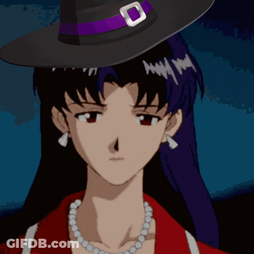 A Woman Wearing A Witch Hat And A Necklace With The Words Its Misato Above Her GIF