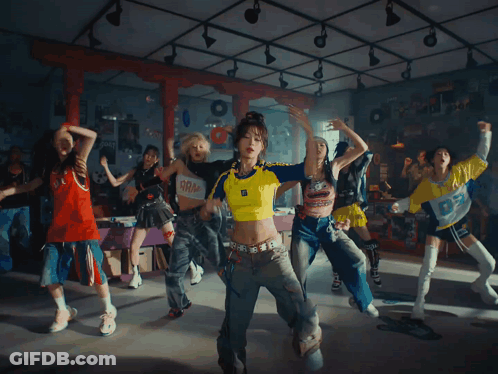 A Woman Wearing A Yellow And Blue Shirt With The Letter O On It GIF