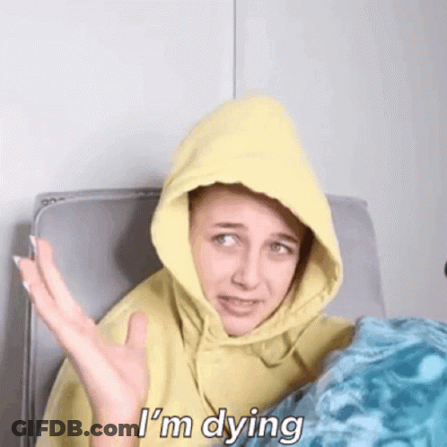 A Woman Wearing A Yellow Hoodie Is Saying I 'M Dying GIF