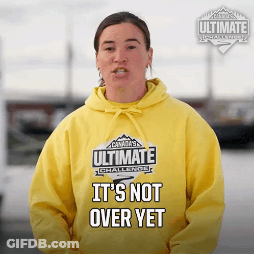 A Woman Wearing A Yellow Hoodie That Says Canada 'S Ultimate Challenge It 'S Not Over Yet GIF