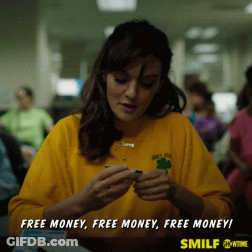 A Woman Wearing A Yellow Shirt That Says Barley Tea Is Sitting At A Table GIF