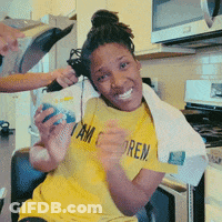 A Woman Wearing A Yellow Shirt That Says " I Am Sore " GIF