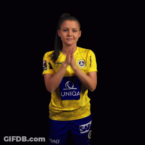 A Woman Wearing A Yellow Shirt That Says Uniqa On The Front GIF