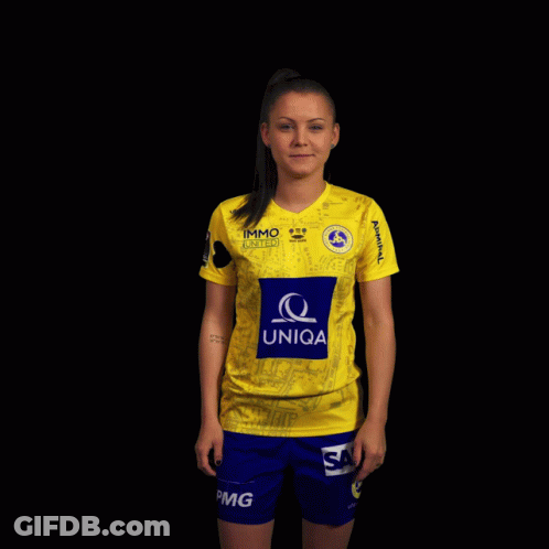 A Woman Wearing A Yellow Shirt With The Word Uniqa On The Front GIF
