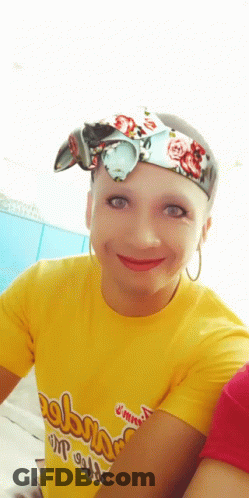 A Woman Wearing A Yellow T-Shirt That Says " Always " On It GIF