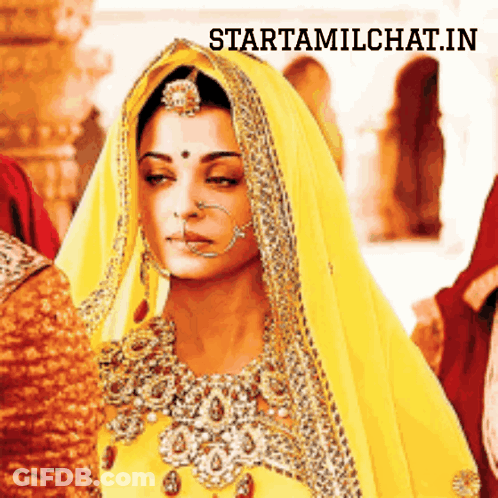 A Woman Wearing A Yellow Veil With The Words Starttamilchat.in Above Her GIF