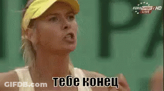 A Woman Wearing A Yellow Visor And A White Tank Top Is Talking To Someone In A Foreign Language . GIF