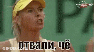 A Woman Wearing A Yellow Visor Is Making A Funny Face While Talking In Russian GIF