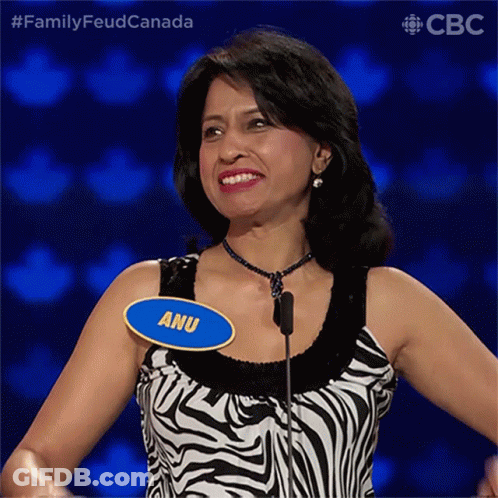 A Woman Wearing A Zebra Print Top Has A Name Tag That Says Anu GIF