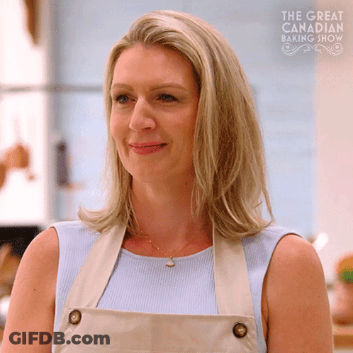 Woman In Apron Blue Shirt Smiling Baking GIF