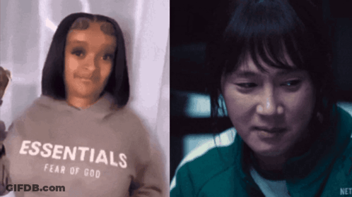 A Woman Wearing An Essentials Hoodie Next To A Man GIF