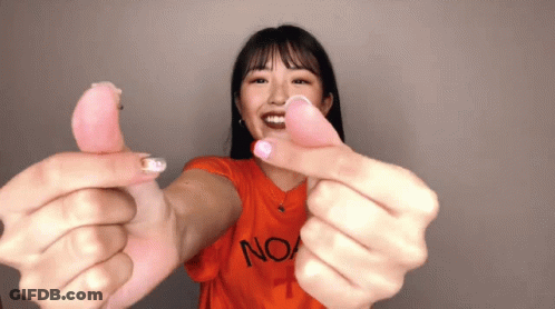 A Woman Wearing An Orange T-Shirt With The Word No On It GIF