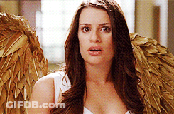 A Woman Wearing Angel Wings Looks Surprised And Shocked GIF