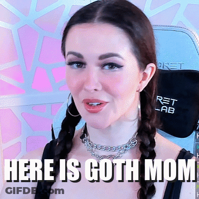 A Woman Wearing Braids And A Necklace With The Words Here Is Goth Mom Written Below Her GIF