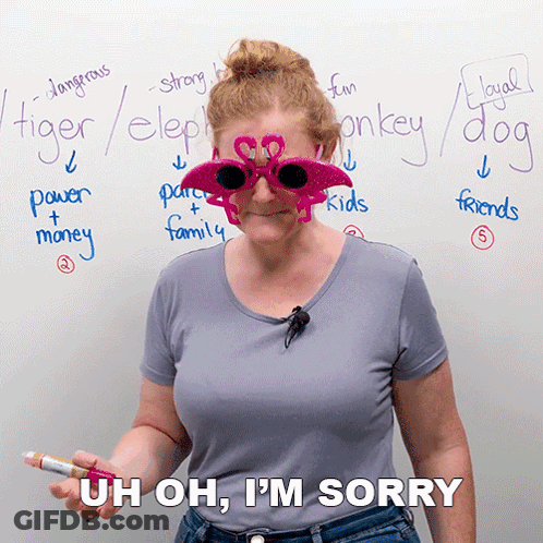 A Woman Wearing Flamingo Sunglasses Is Standing In Front Of A Whiteboard With Words Like Tiger Elephant And Monkey Writt GIF