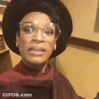 Woman Wearing Glasses Hat Making Funny Face GIF