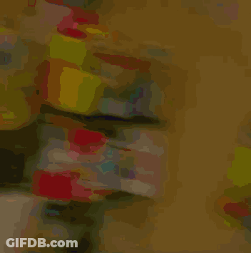 A Woman Wearing Glasses And A Beanie With A Light On Her Head GIF