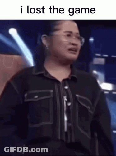 A Woman Wearing Glasses And A Black Shirt Is Crying . GIF