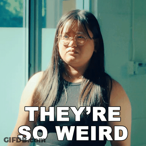 A Woman Wearing Glasses And A Black Tank Top Says They 'Re So Weird GIF