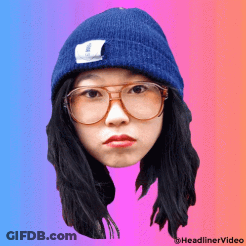 A Woman Wearing Glasses And A Blue Beanie Has A Headlinervideo Watermark GIF