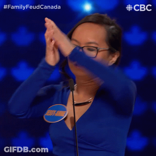 A Woman Wearing Glasses And A Blue Shirt With The Name Jessy Anne On It GIF