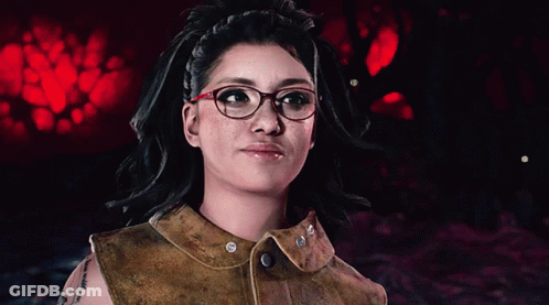 A Woman Wearing Glasses And A Brown Leather Vest GIF