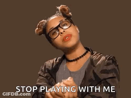 A Woman Wearing Glasses And A Choker Says Stop Playing With Me . GIF