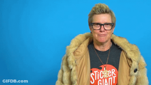A Woman Wearing Glasses And A Fur Coat Has The Word Baller Written Above Her Head GIF