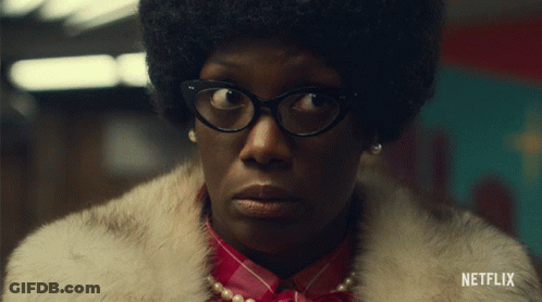 A Woman Wearing Glasses And A Fur Coat With Netflix Written On The Bottom Right GIF