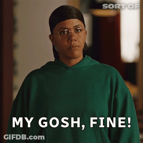 A Woman Wearing Glasses And A Green Sweatshirt Says My Gosh Fine GIF