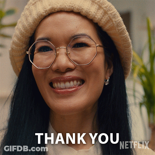 A Woman Wearing Glasses And A Hat Is Smiling And Says Thank You GIF