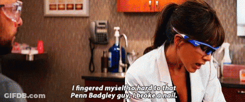 A Woman Wearing Glasses And A Lab Coat Is Talking To A Man In A Lab . GIF