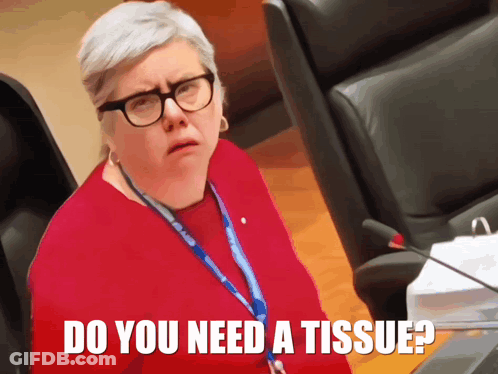 A Woman Wearing Glasses And A Lanyard With The Words Do You Need A Tissue GIF