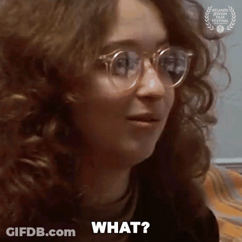 Woman With Glasses And Laurel Wreath Asking What GIF