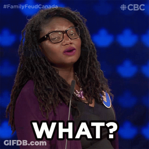 A Woman Wearing Glasses And A Purple Jacket Says " What " GIF