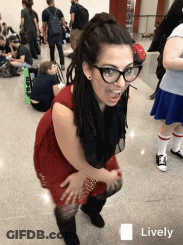 A Woman Wearing Glasses And A Red Dress Has A Lively Icon On The Bottom GIF