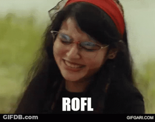 A Woman Wearing Glasses And A Red Headband Is Smiling And The Word Rofl Is Written On The Screen . GIF