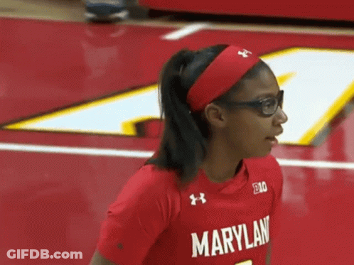 A Woman Wearing Glasses And A Red Maryland Shirt GIF