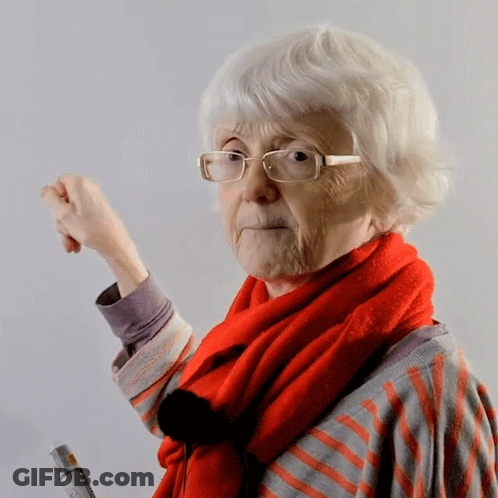 A Woman Wearing Glasses And A Red Scarf Holds A Bottle Of Glue GIF