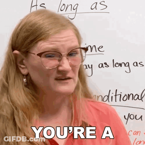 A Woman Wearing Glasses And A Red Shirt Says You 'Re A GIF
