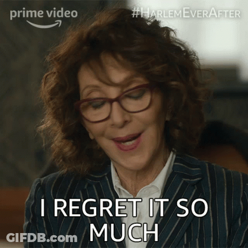 A Woman Wearing Glasses And A Striped Suit Says I Regret It So Much GIF