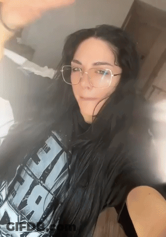 A Woman Wearing Glasses And A T-Shirt That Says " Star Wars " GIF