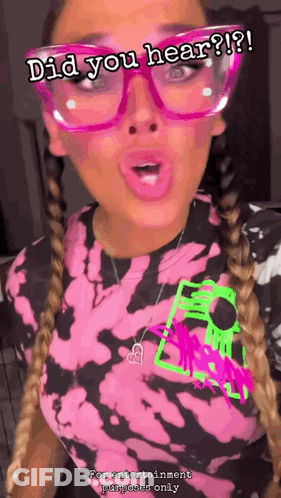 A Woman Wearing Glasses And A Tie Dye Shirt With The Words Did You Hear GIF