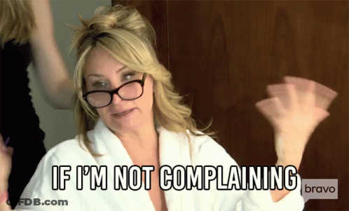 A Woman Wearing Glasses And A White Robe Says If I 'M Not Complaining GIF