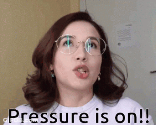 A Woman Wearing Glasses And A White Shirt Says " Pressure Is On " GIF