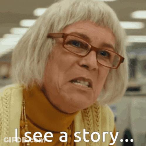 A Woman Wearing Glasses And A Yellow Sweater Has The Words " I See A Story " On Her Face GIF