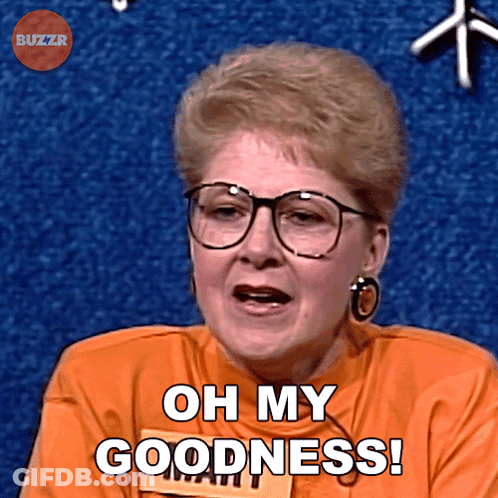 A Woman Wearing Glasses And An Orange Shirt Says " Oh My Goodness " GIF